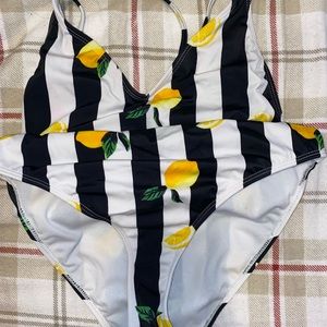 Black and white striped one piece bathing suit with lemons